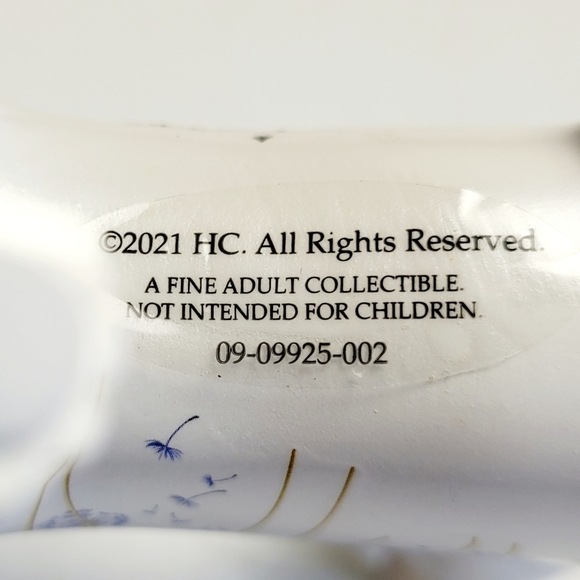 White Cat Looking Back at a Red Bird That Had Landed on His Back - Picture 11 of 12